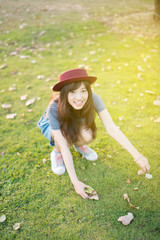 Portrait asian woman smiling happy freedom in park with sunlight