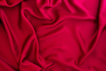 Close up wave red silk or satin fabric background