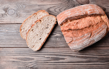 Rye bread on wooden table.

