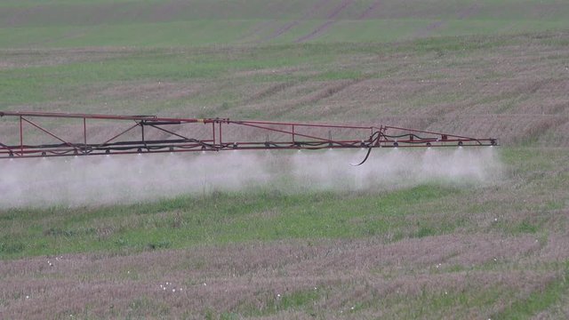sprayer wing spray special liquid to kill weeds in stubble field. 4K