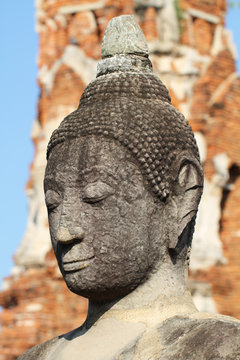 head, face, lobe, ear, hair, nose of ancient stone grey buddha statue, art sculpture 