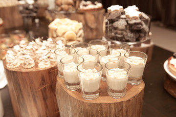 decoration of dessert on wood table in the restaurant with vinta