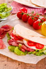 Piadina with ham and lettuce. 