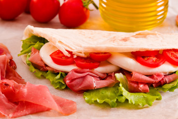 Piadina with ham and lettuce. 