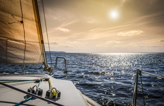 Fototapeta Yachting/On the yacht toward the sun.