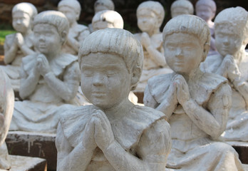 girls statues in meditation