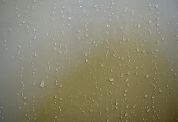 Water droplets adhered on the bathroom door.