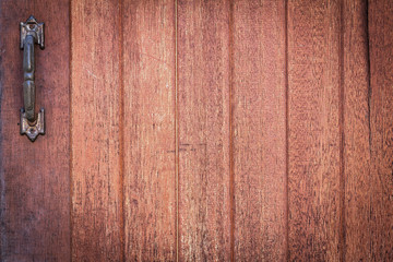 Wood texture background with old metal door handle for design with copy space for text or image. Wood motifs that occurs natural.
