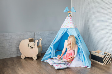 Parents with children in a teepee