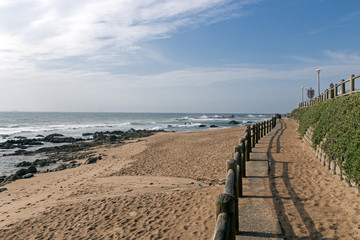 Retaining Wall and Wooden Barrier on Empty Beach