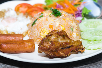 American fried rice on plate on wood table
