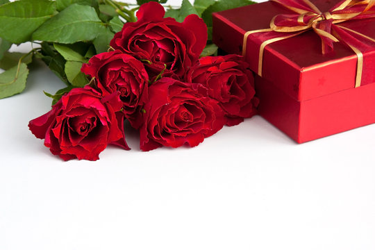 Bouquet of red roses and gift box , Valentines Day background