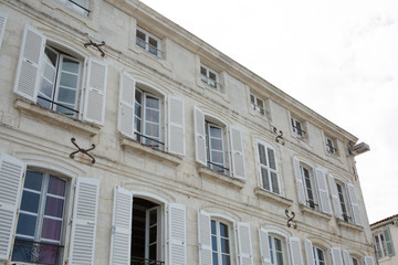 Facade of beautiful classic house and typical of the coast Charentaise in france or the island of Ré