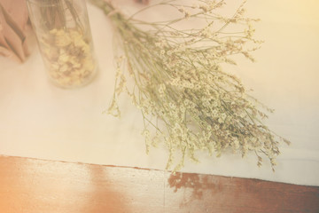 Bunch of tiny flower grass have decoration on wooden table