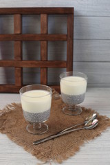 Fresh homemade coconut yogurt in glass cups served with fresh berries