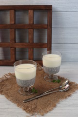 Fresh homemade coconut yogurt in glass cups served with fresh berries