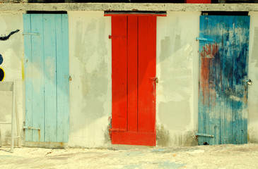 rural multicolored run-down doors, toned image