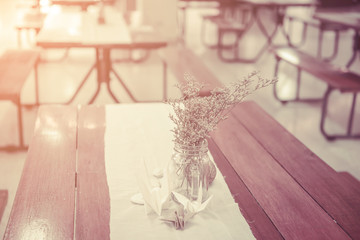 Bunch of tiny flower grass have decoration on wooden table