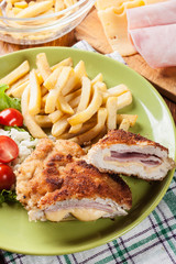 Cutlet Cordon Bleu with pork loin served with French fries and s