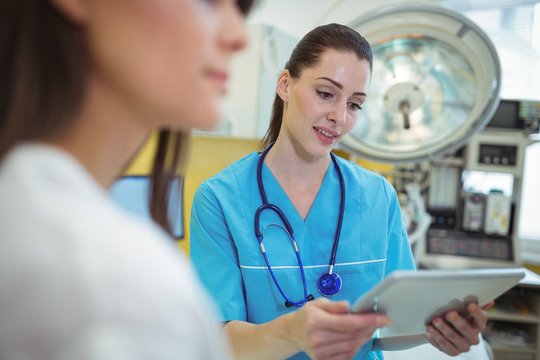 Female nurse using digital tablet