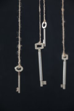 Keys hanging on strings