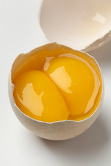 Broken double yolk egg