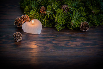 Warm winter composition with a candle / background