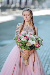 Wedding flowers bride ,Woman holding colorful bouquet with her hands. Tattoo