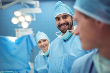 Portrait of male surgeon standing in operation theater