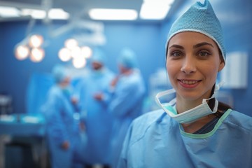 Portrait of female surgeon smiling in operation theater