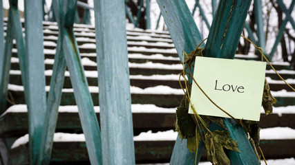 Stairs leading up, words on paper sticker
