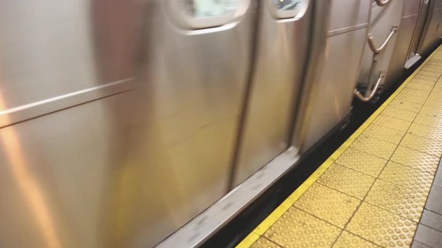 Train arriving at subway station platform in New York
