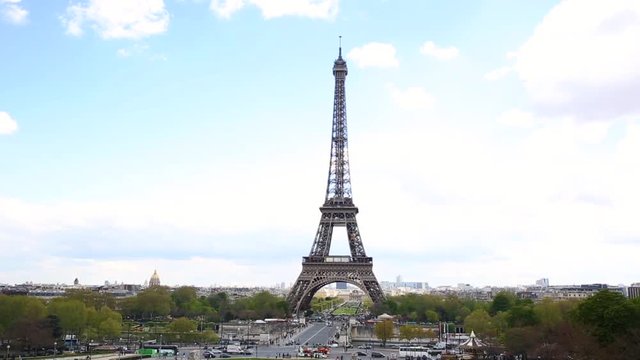 Paris panoramic view with the Eiffel Tower as main subject. Hand held video with pan righ movement of the most famous monument in Paris