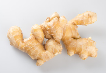 Ginger or fresh ginger on a background.