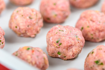 Preparing Raw Turkey Meatballs In Pan