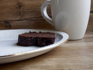 Chocolate cake with a cup