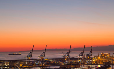 GENOA (GENOVA) , ITALY, DECEMBER 28, 2016: Sunset view of the city of Genoa, Italy, The harbor with Lanterna (lighthouse) the symbol of the city.
