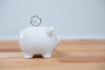 Fototapeta premium Close-up of piggy bank and clock