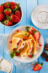 Crepes with strawberries and cream 