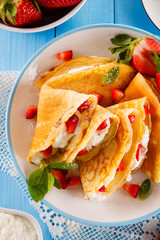 Crepes with strawberries and cream 