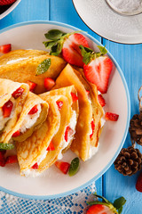 Crepes with strawberries and cream 