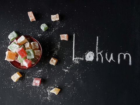 Turkish delight lokum on a blackboard background