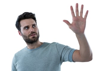 Man pretending to touch an invisible screen