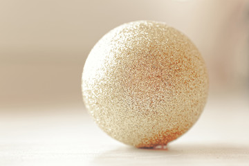 Golden glitter Christmas ball. Luxurious xmas shine sphere.