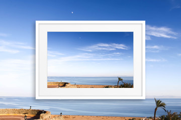 Frame mock up on blue sky and sea view wallpaper. Interior decor concept, Travelling motif poster