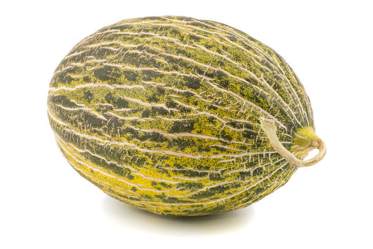 One Fresh whole Piel de sapo melon on white background.