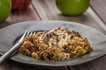 Apple Crumble Crust in Iron Cast in a plate with a fork