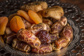 Fototapeta na wymiar Ramadan Dates and Dried Fruits Iftar Plate