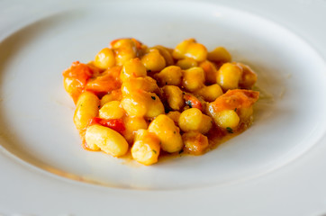 Tomato dumplings on white porcelain plate