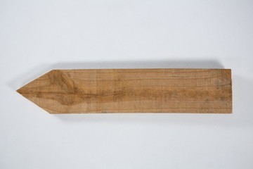 Close-up of wooden arrow sign